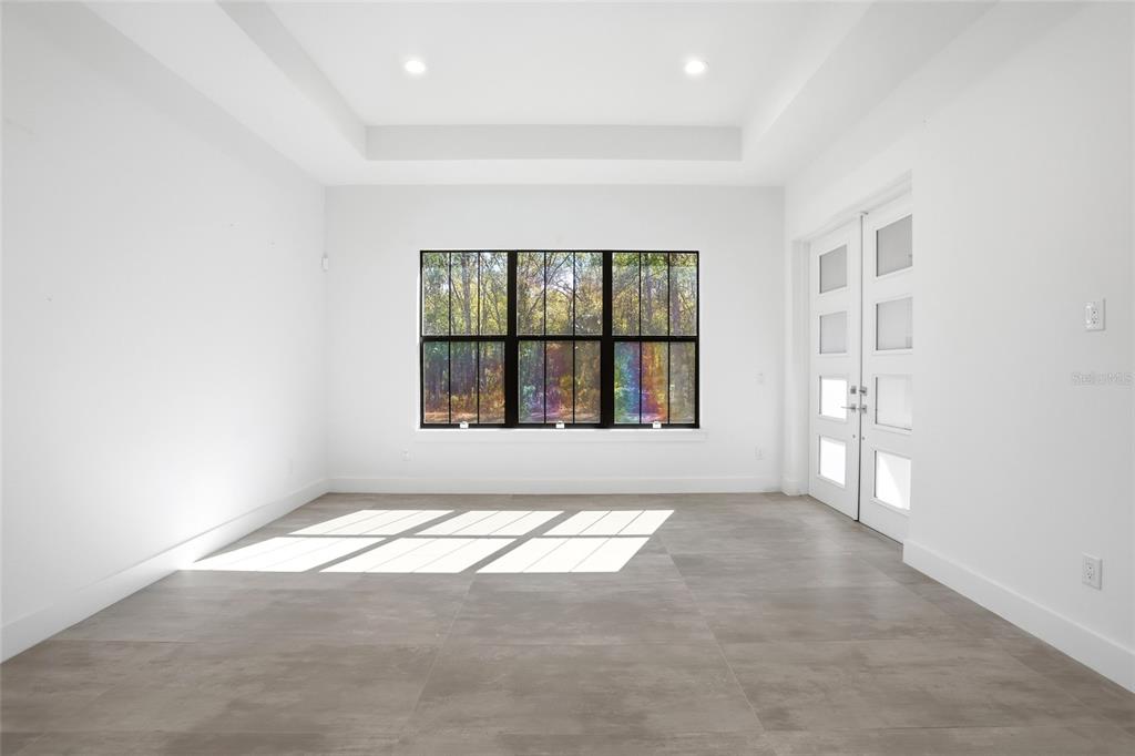 16728 Bearle Road Orlando, FL 32828 - Photo 40 of 72 an empty room with windows