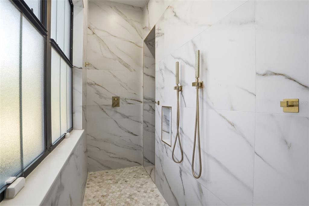 16728 Bearle Road Orlando, FL 32828 - Photo 43 of 72 a bathroom with a shower