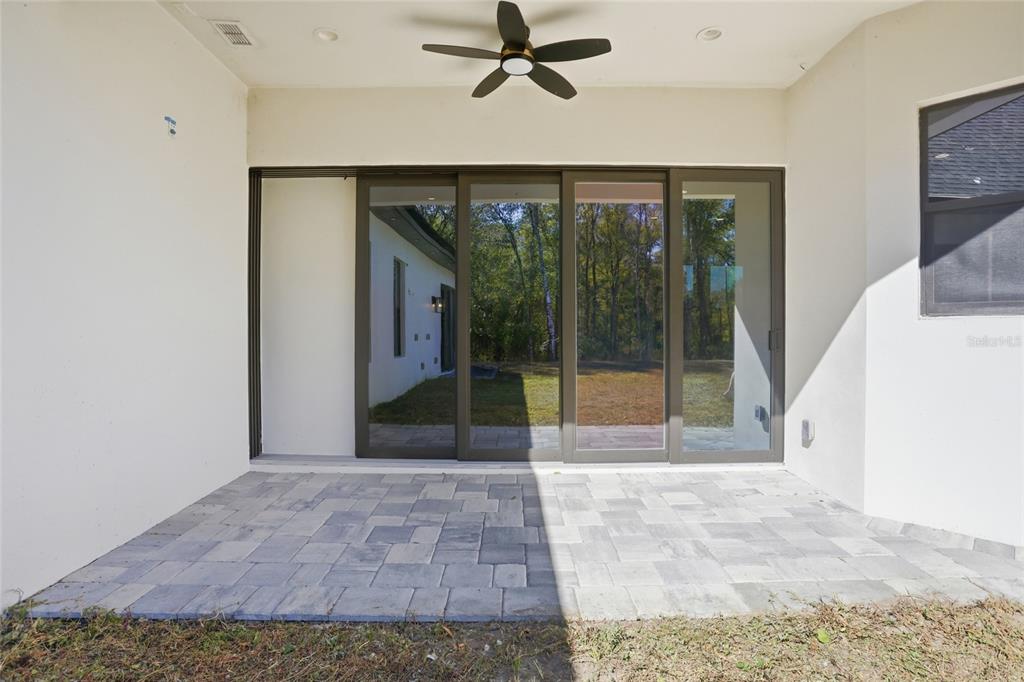 16728 Bearle Road Orlando, FL 32828 - Photo 49 of 72 a view of a room with a ceiling fan and window