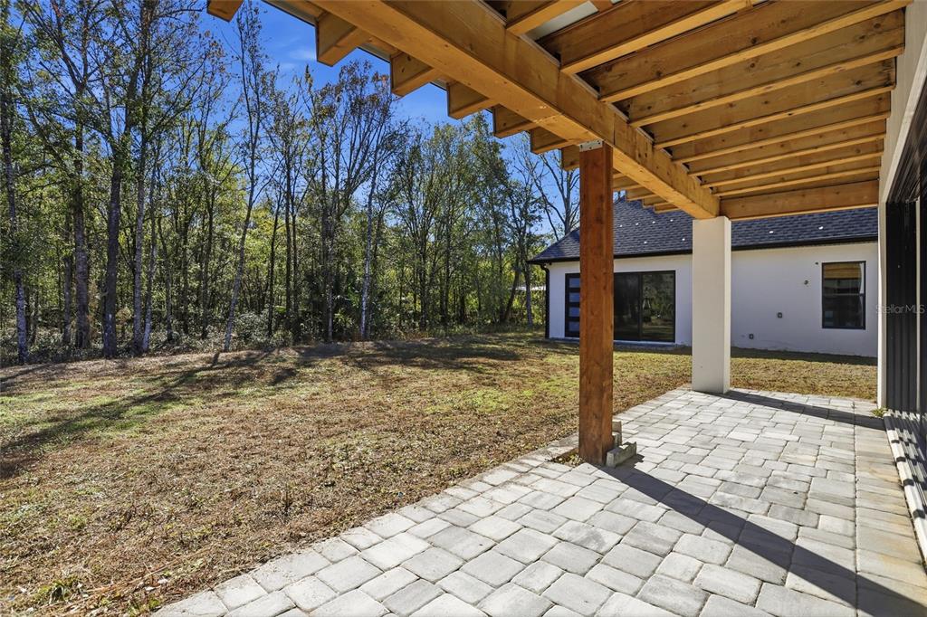 16728 Bearle Road Orlando, FL 32828 - Photo 52 of 72 a house with trees in front of it