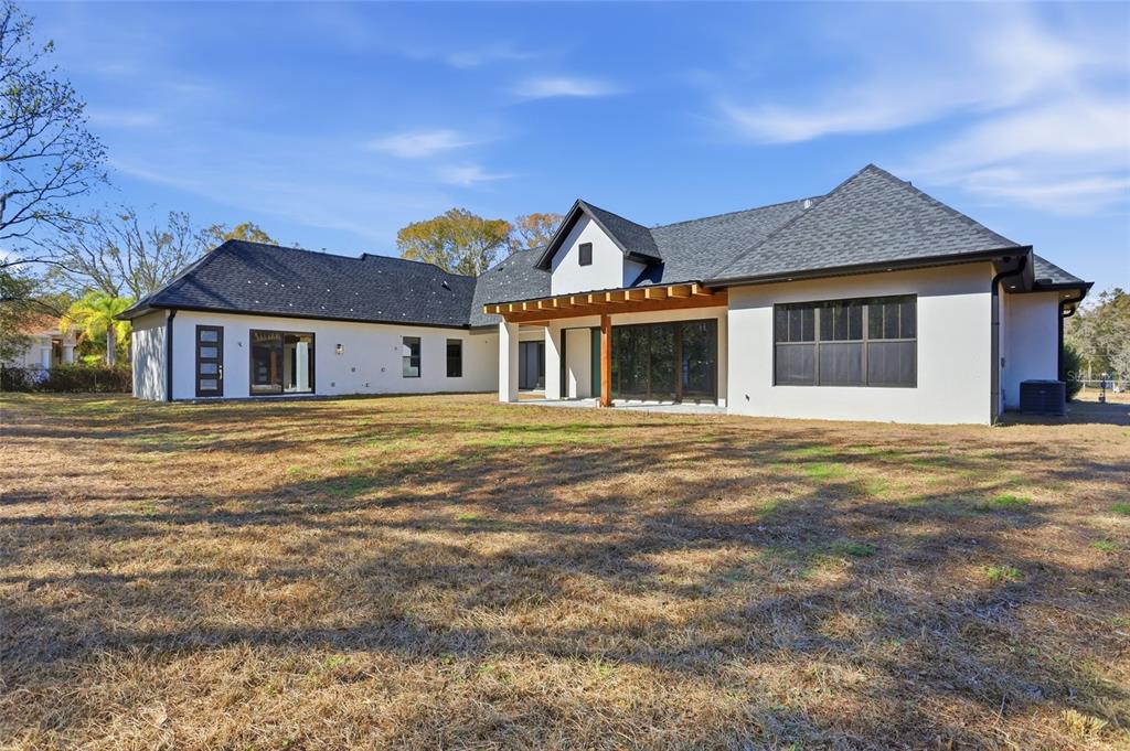 16728 Bearle Road Orlando, FL 32828 - Photo 54 of 72 a front view of a house with a garden