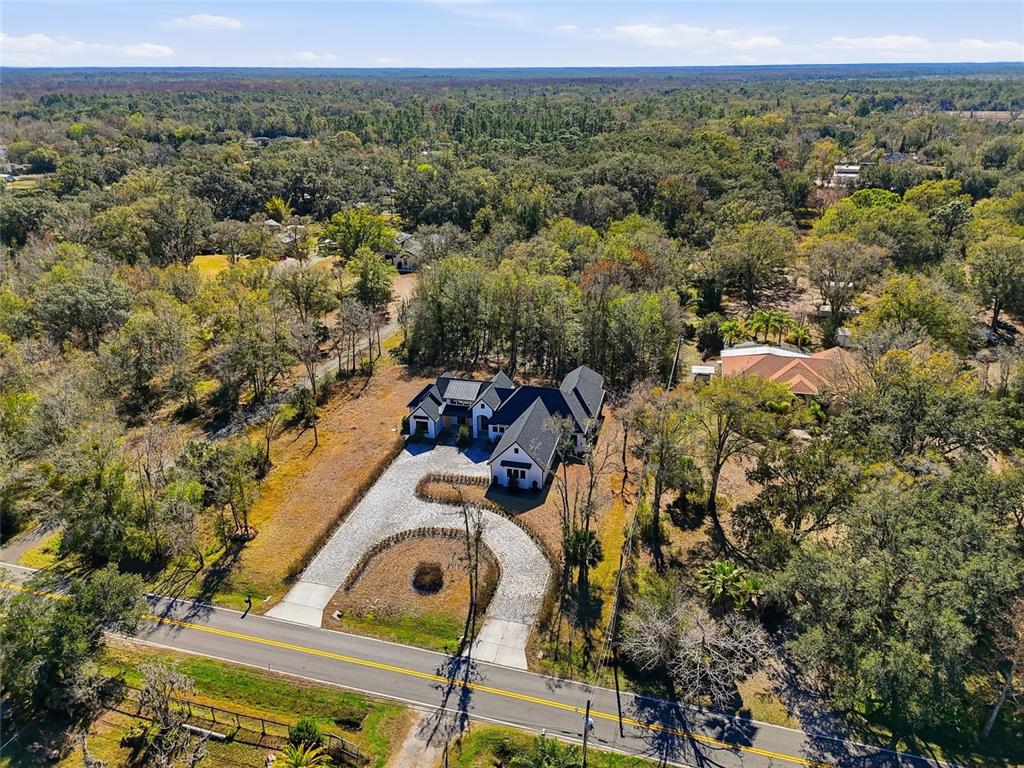 16728 Bearle Road Orlando, FL 32828 - Photo 62 of 72 an aerial view of a house with a yard