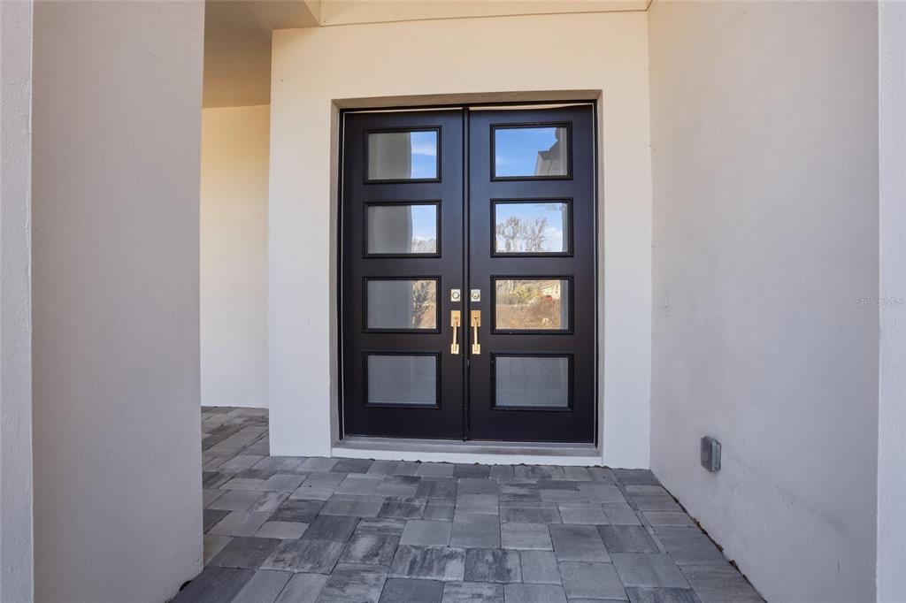16728 Bearle Road Orlando, FL 32828 - Photo 7 of 72 a view of a front door of a house
