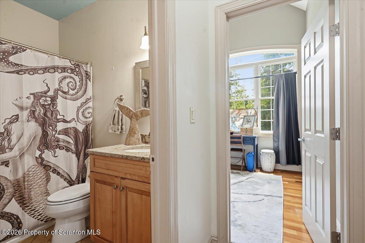 99 Hilltop Road Waverly, PA 18471 - Photo 20 of 41 a bathroom with a toilet sink and shower