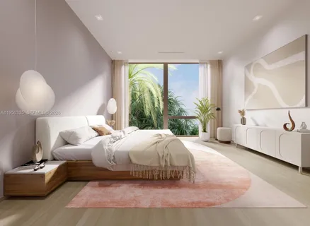 a bedroom with a large bed and a large window