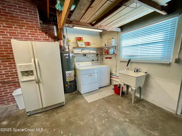 a bed room with a bed and a painting on the wall