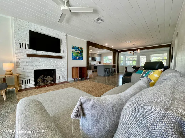 a living room with furniture or fireplace and a flat screen tv
