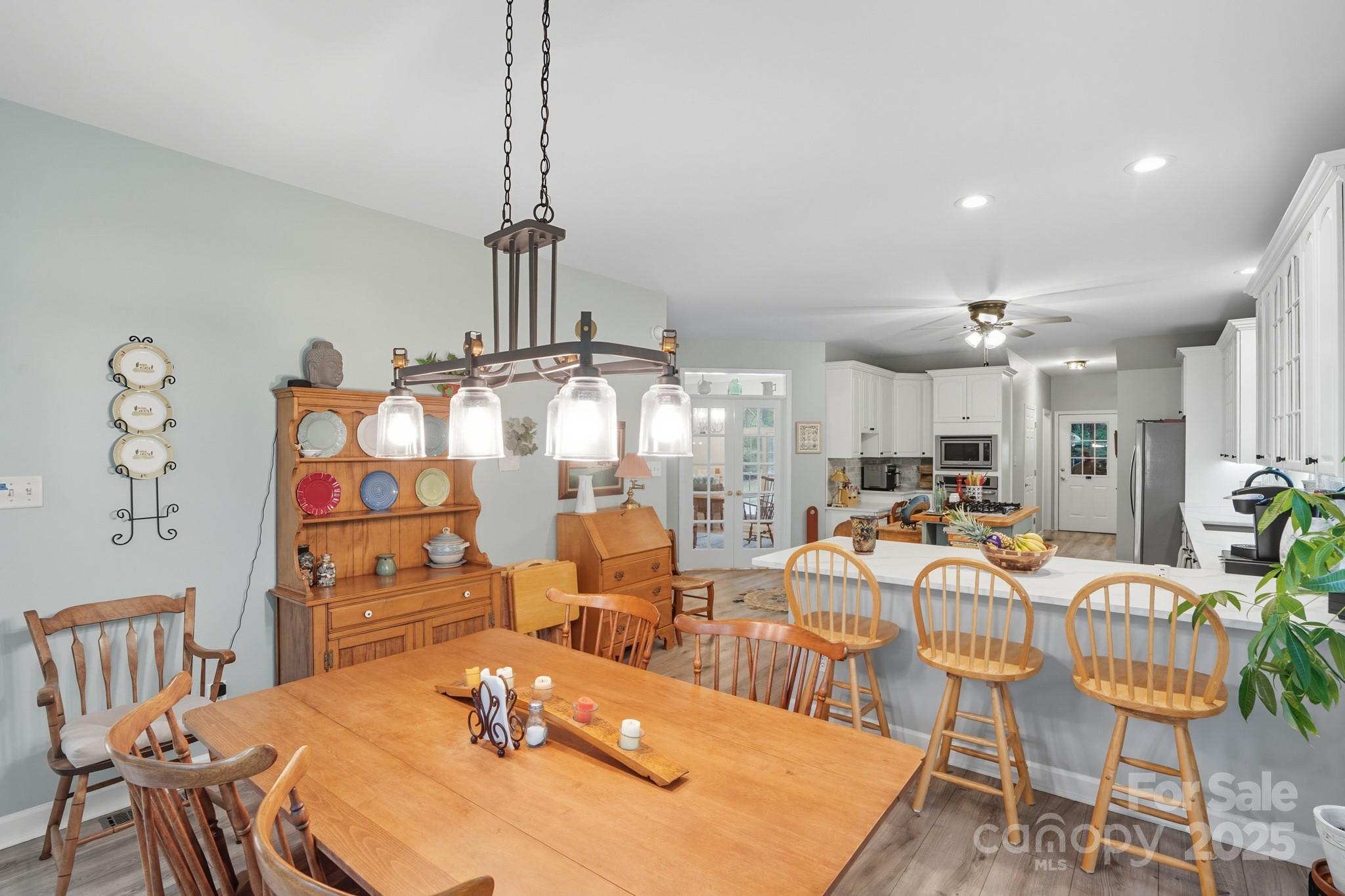 316 Brigadier Drive Clover, SC 29710 - Photo 15 of 47 a dining room with furniture a chandelier and wooden floor