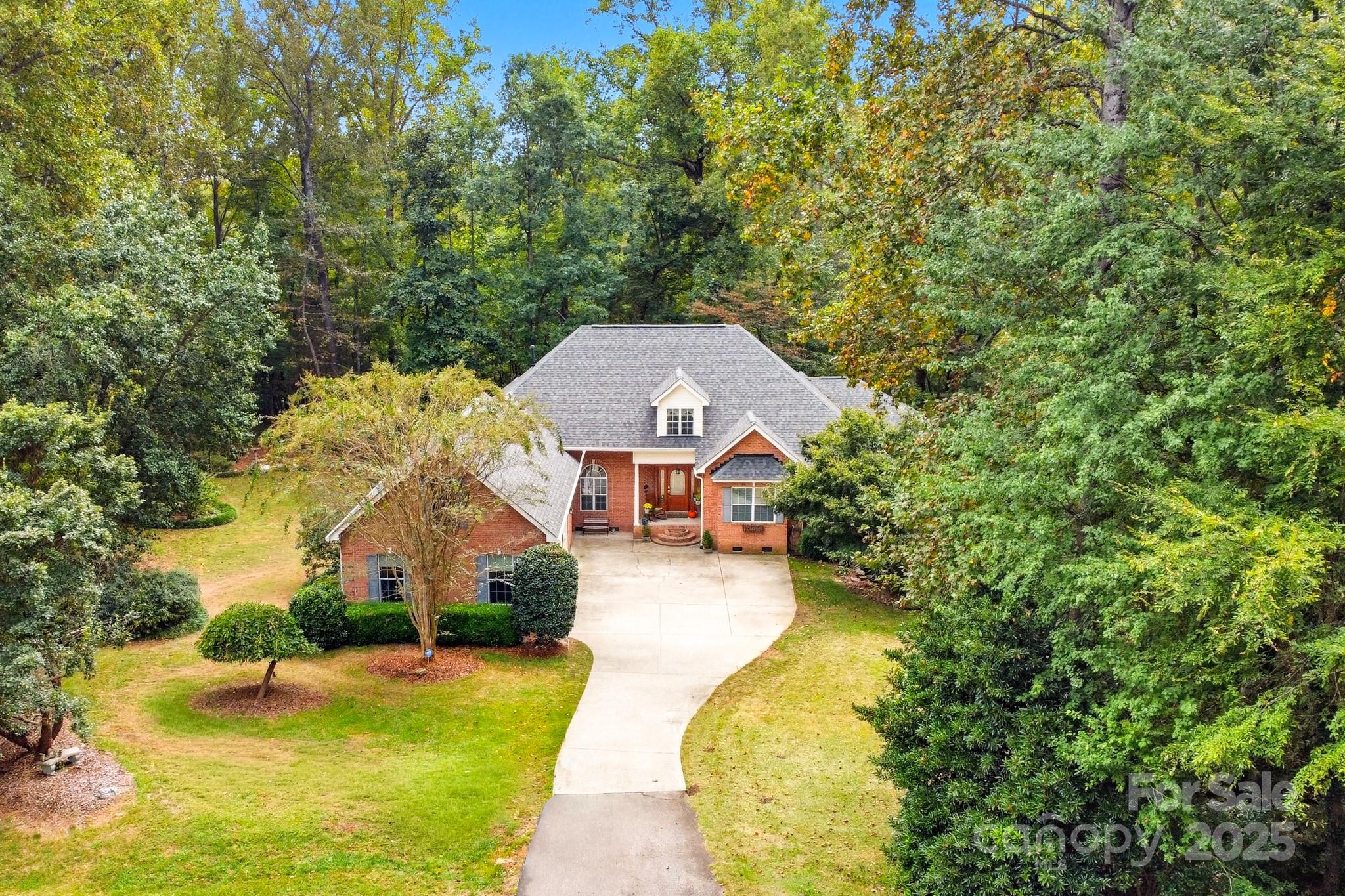 316 Brigadier Drive Clover, SC 29710 - Photo 2 of 47 an aerial view of a house with swimming pool and large trees