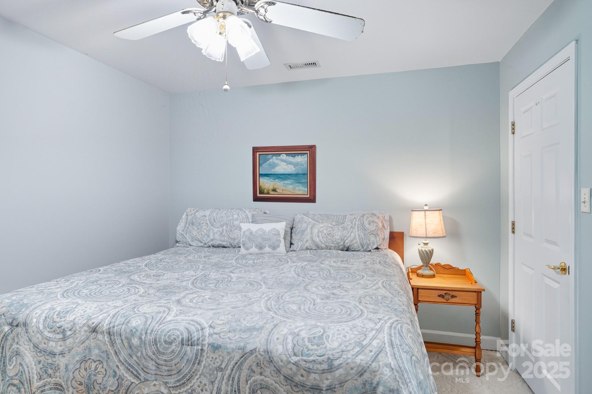 316 Brigadier Drive Clover, SC 29710 - Photo 34 of 47 a bedroom with a bed and a lamp on dresser