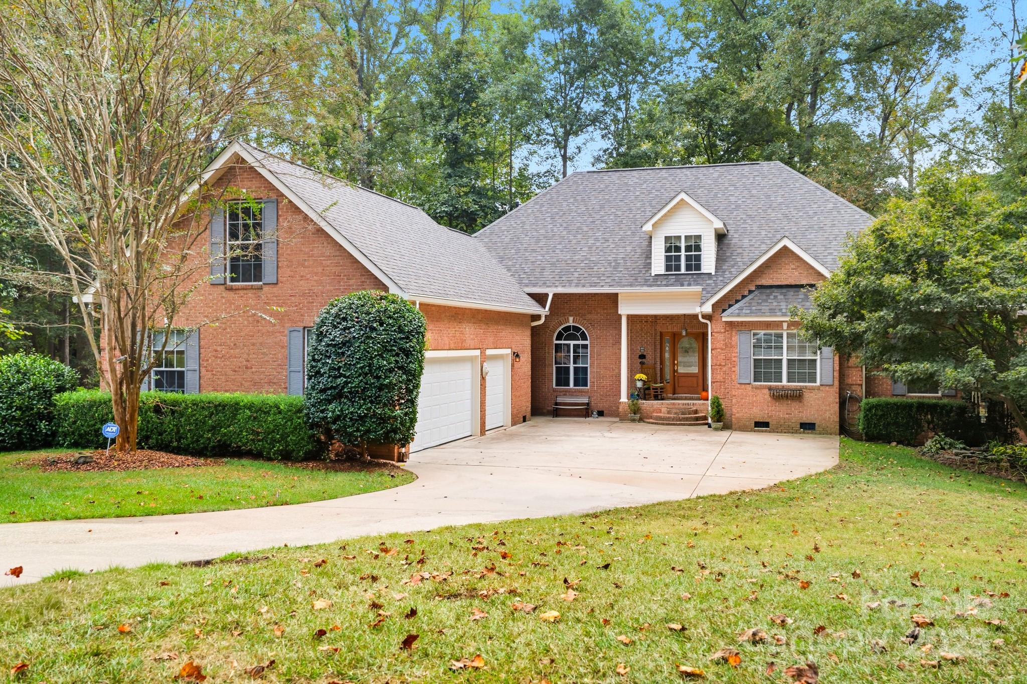 316 Brigadier Drive Clover, SC 29710 - Photo 4 of 47 a front view of a house with a yard and garage