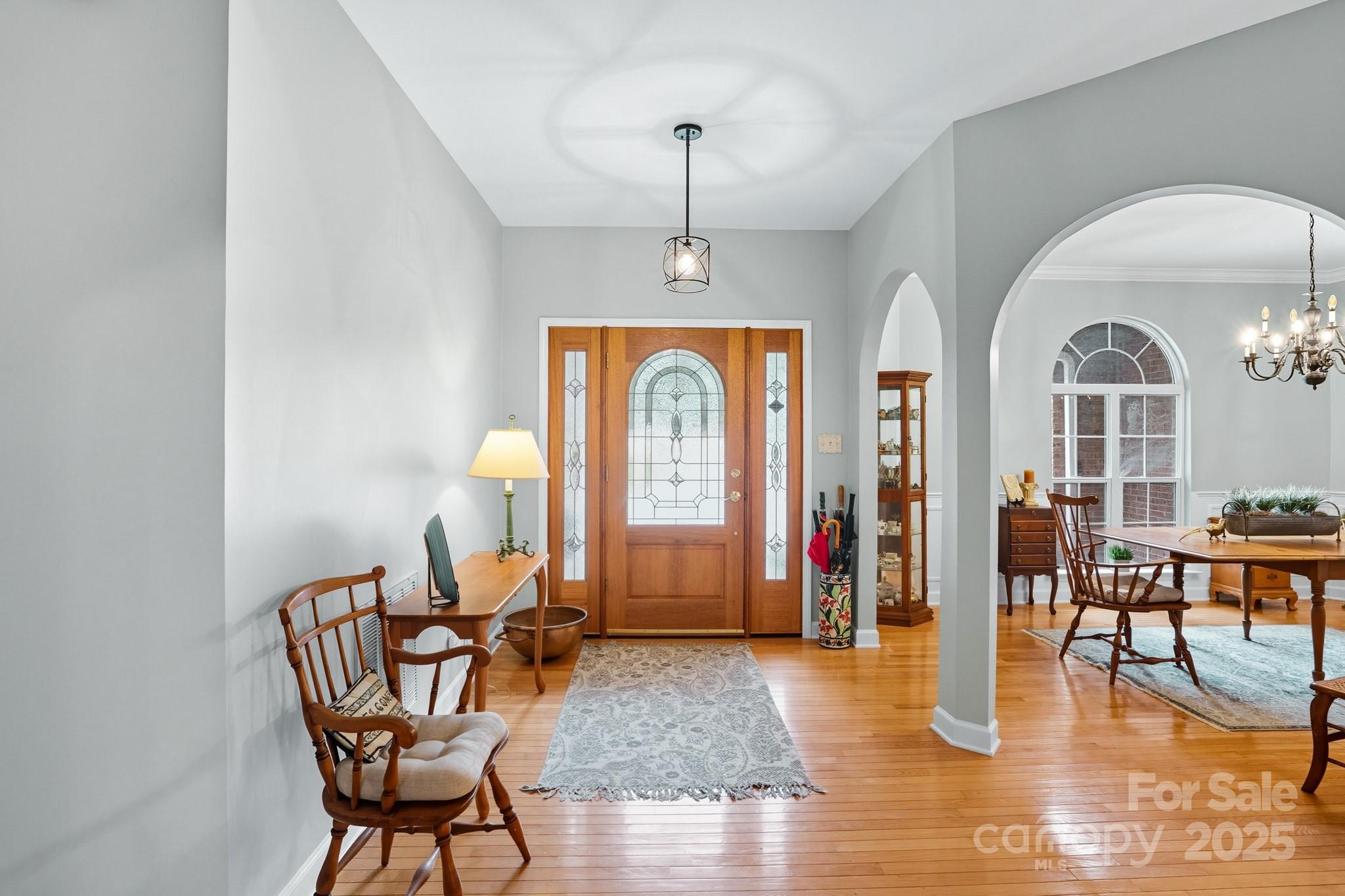 316 Brigadier Drive Clover, SC 29710 - Photo 6 of 47 a view of a livingroom with furniture wooden floor windows and a chandelier