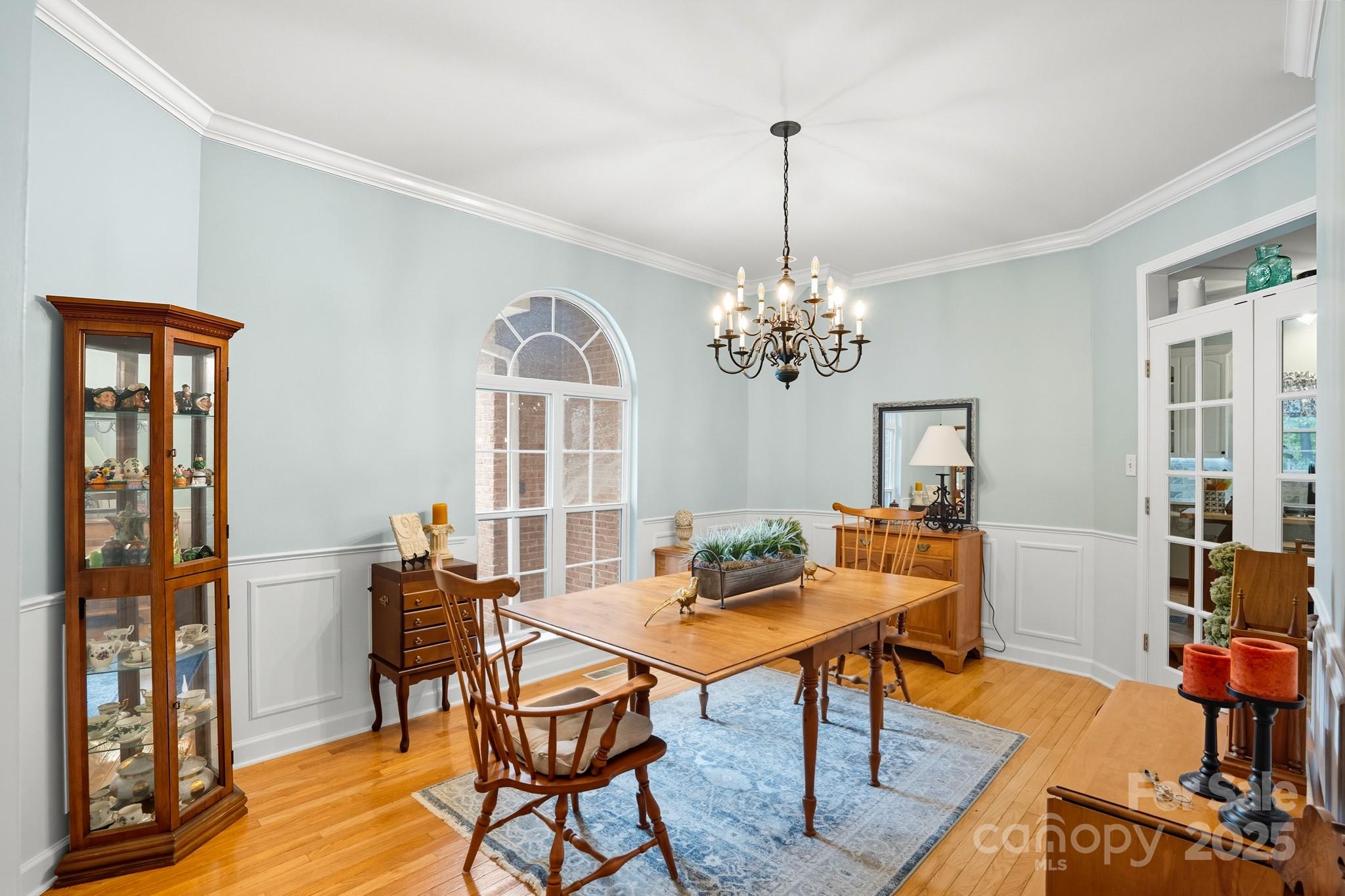 316 Brigadier Drive Clover, SC 29710 - Photo 7 of 47 a dining room with furniture a chandelier and wooden floor
