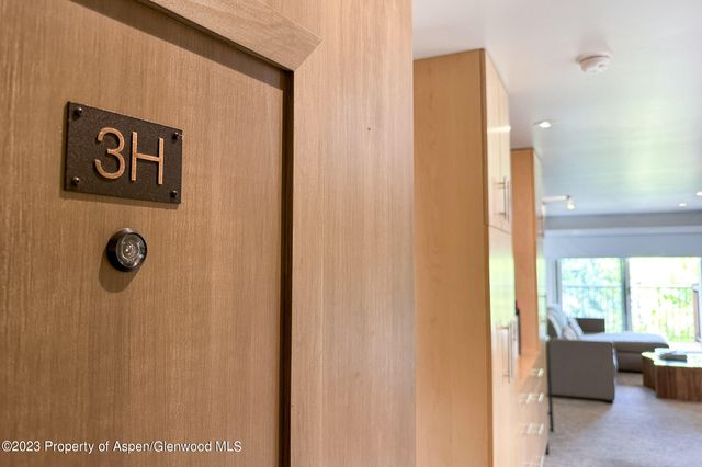 a view of a room with furniture and windows