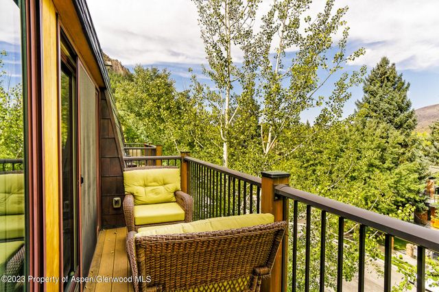 a view of a balcony with wooden floor