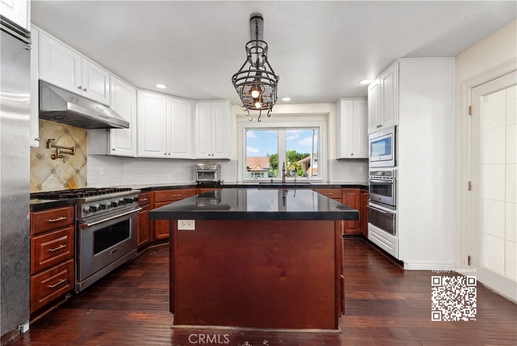 21732 Exton Way Lake Forest, CA 92630 - Photo 7 of 52 Kitchen with Viking appliances. Digitally enhanced with virtual paint.