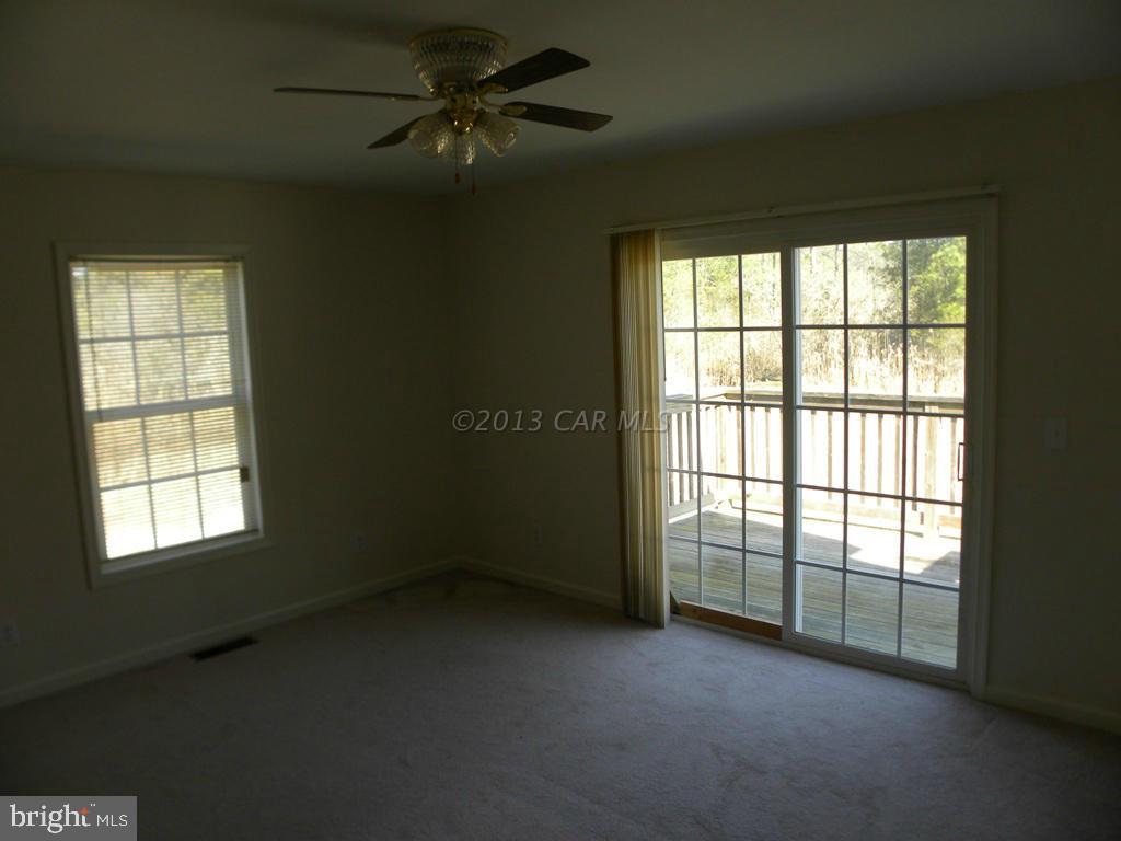 26306 Deal Island Road Princess Anne, MD 21853 - Photo 14 of 18 an empty room with a window