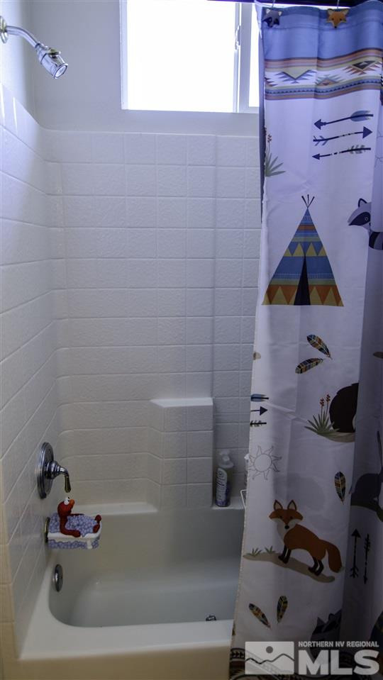 7500 Celeste Drive Reno, NV 89511 - Photo 11 of 20 a bathroom with a bathtub and shower