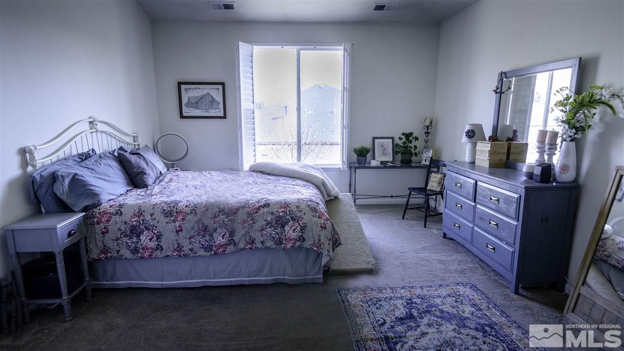 7500 Celeste Drive Reno, NV 89511 - Photo 12 of 20 a bedroom with a bed and a dresser