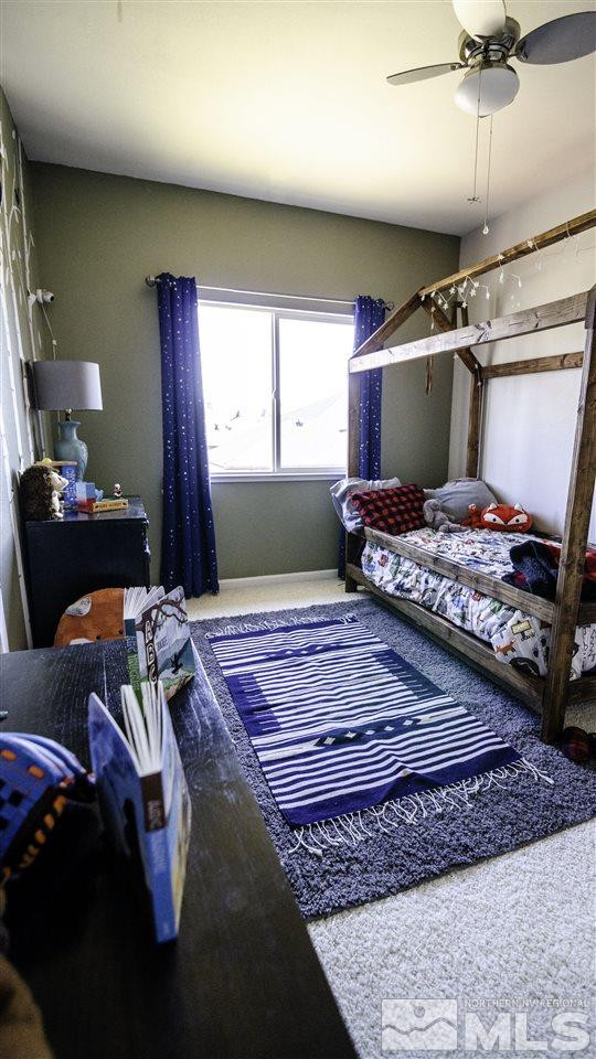 7500 Celeste Drive Reno, NV 89511 - Photo 17 of 20 a bedroom with a bed and a window