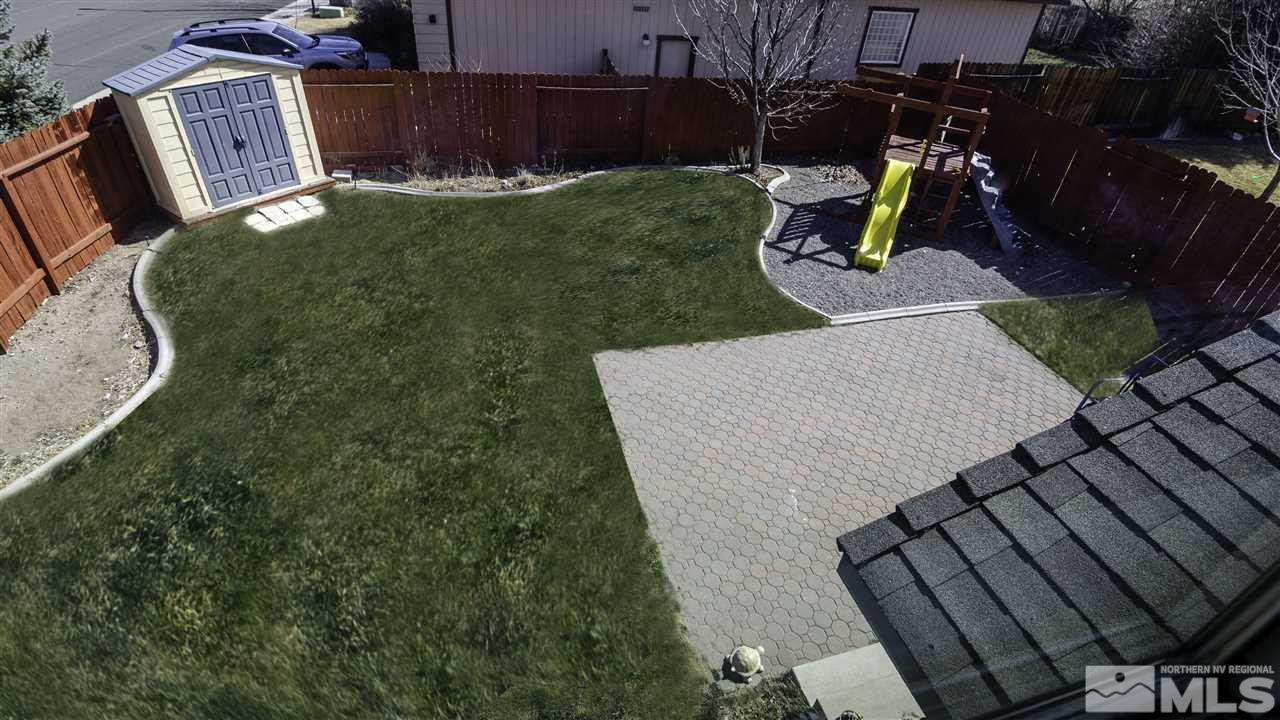 7500 Celeste Drive Reno, NV 89511 - Photo 18 of 20 a view of a backyard with couches chair and a fire pit