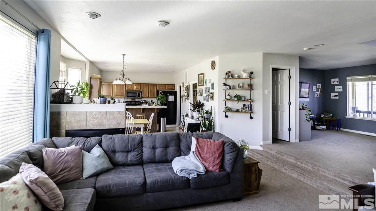7500 Celeste Drive Reno, NV 89511 - Photo 4 of 20 a living room with furniture and a large window