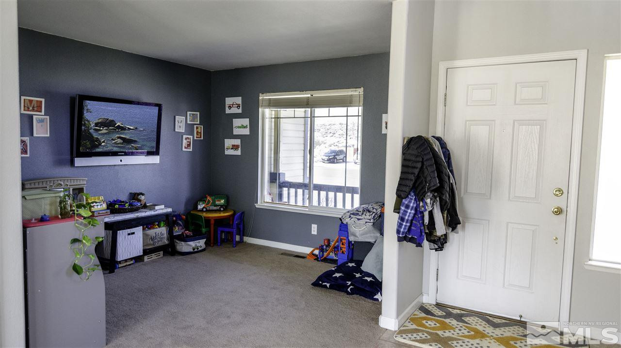 7500 Celeste Drive Reno, NV 89511 - Photo 5 of 20 a bedroom with furniture and a window