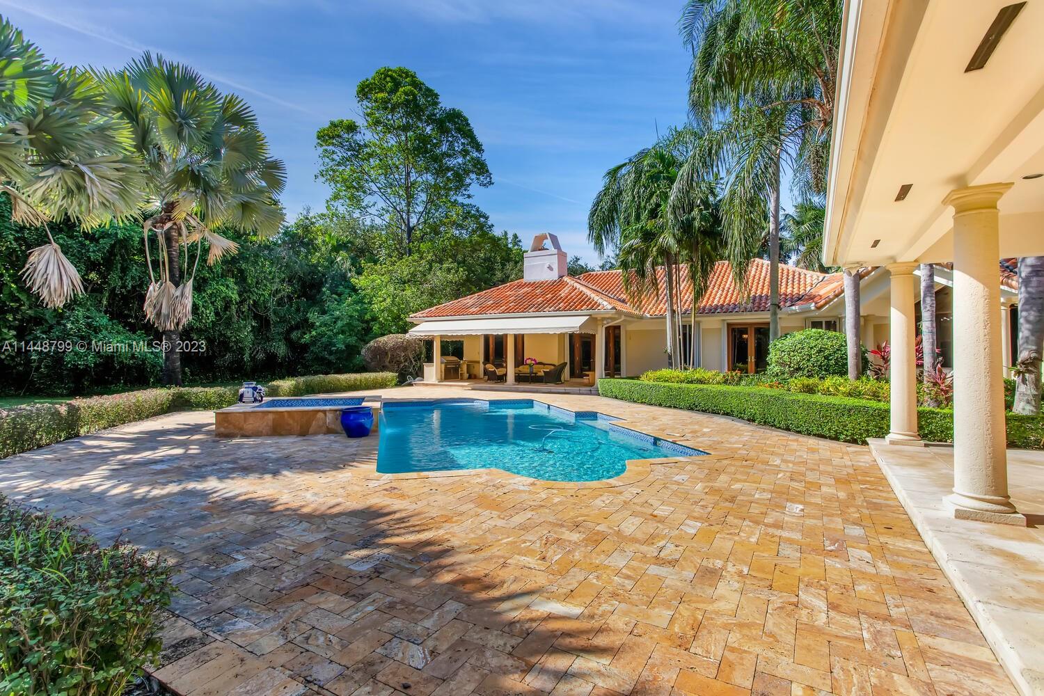 9718 Southwest 58th Court Pinecrest, FL 33156 - Photo 25 of 35 a view of a white house with a yard