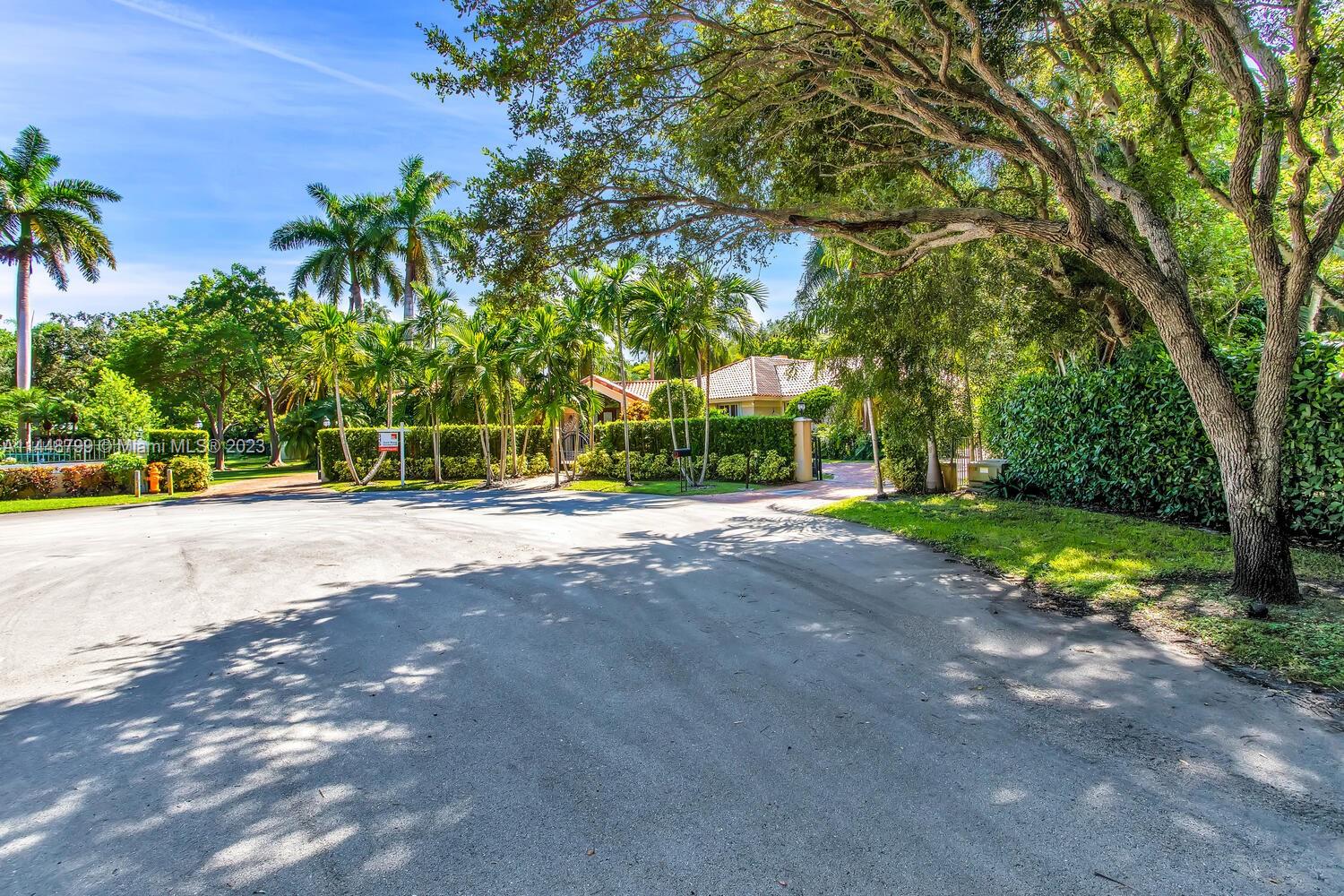 9718 Southwest 58th Court Pinecrest, FL 33156 - Photo 35 of 35 a view of a house with a street