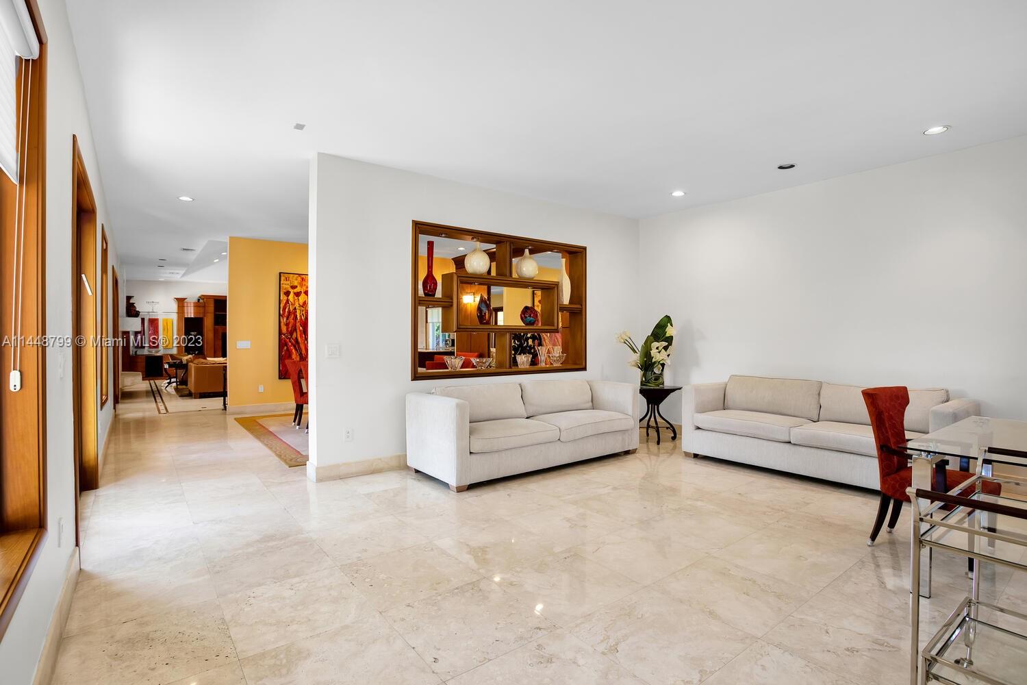 9718 Southwest 58th Court Pinecrest, FL 33156 - Photo 5 of 35 a living room with furniture and a flat screen tv