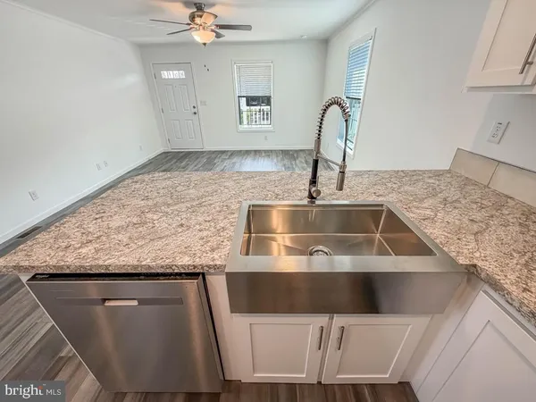 a kitchen with a sink and a stove