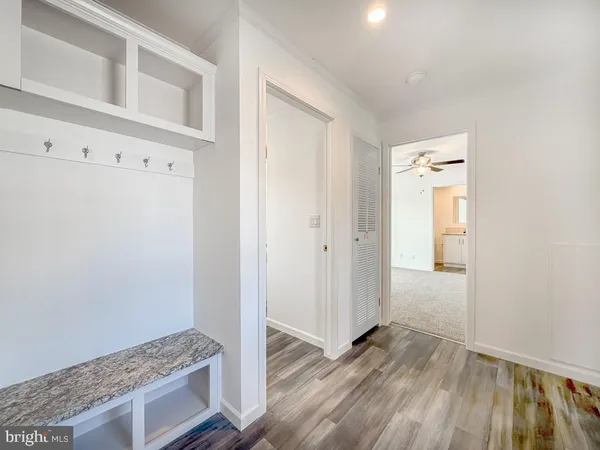 a view of livingroom with hardwood floor and hallway
