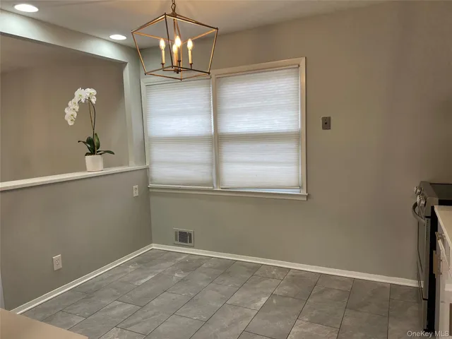 a kitchen with a refrigerator and countertop