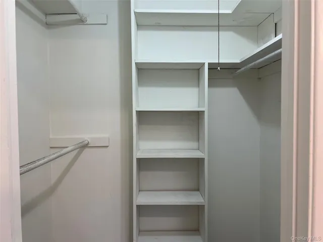 a bathroom with a sink mirror and vanity