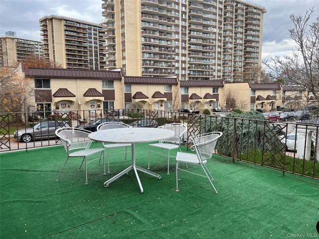 an empty room with wooden floor and entrance