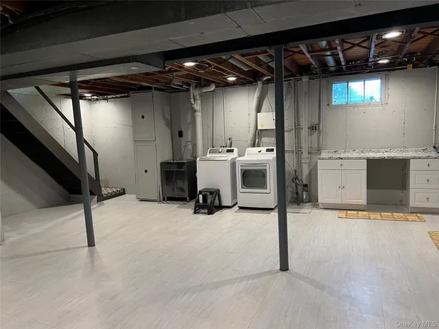 a view of storage and utility room with stairs