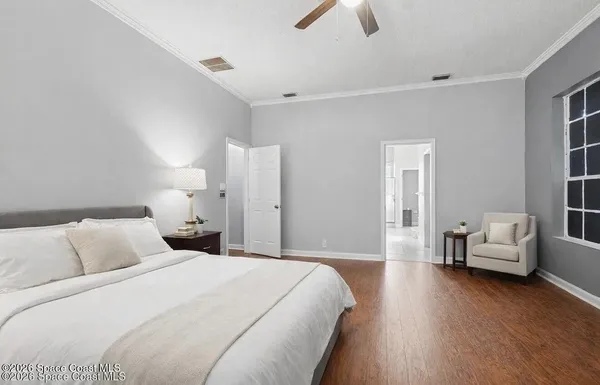 a bedroom with bed and window