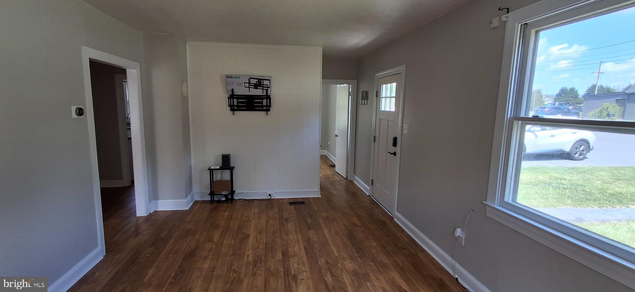 714 Crosby Road Front Royal, VA 22630 - Photo 12 of 37 a view of a hallway with wooden floor and a window