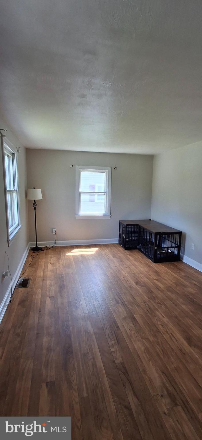 714 Crosby Road Front Royal, VA 22630 - Photo 14 of 37 an empty room with wooden floor and windows
