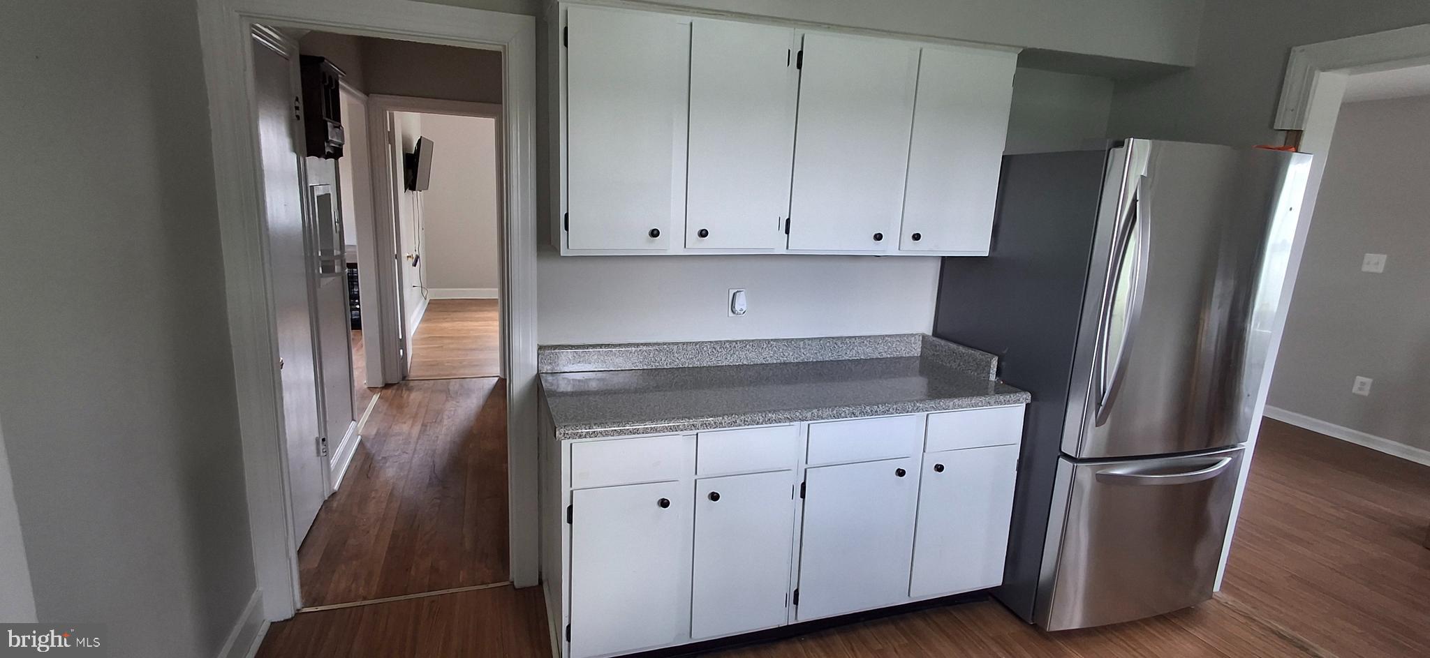 714 Crosby Road Front Royal, VA 22630 - Photo 17 of 37 a kitchen with a refrigerator and cabinets