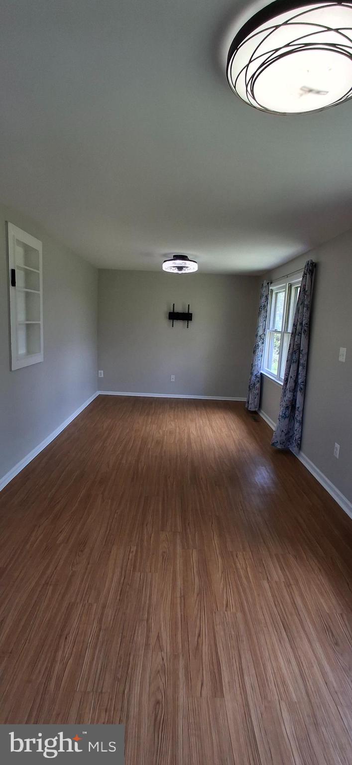 714 Crosby Road Front Royal, VA 22630 - Photo 33 of 37 wooden floor in an empty room with a window