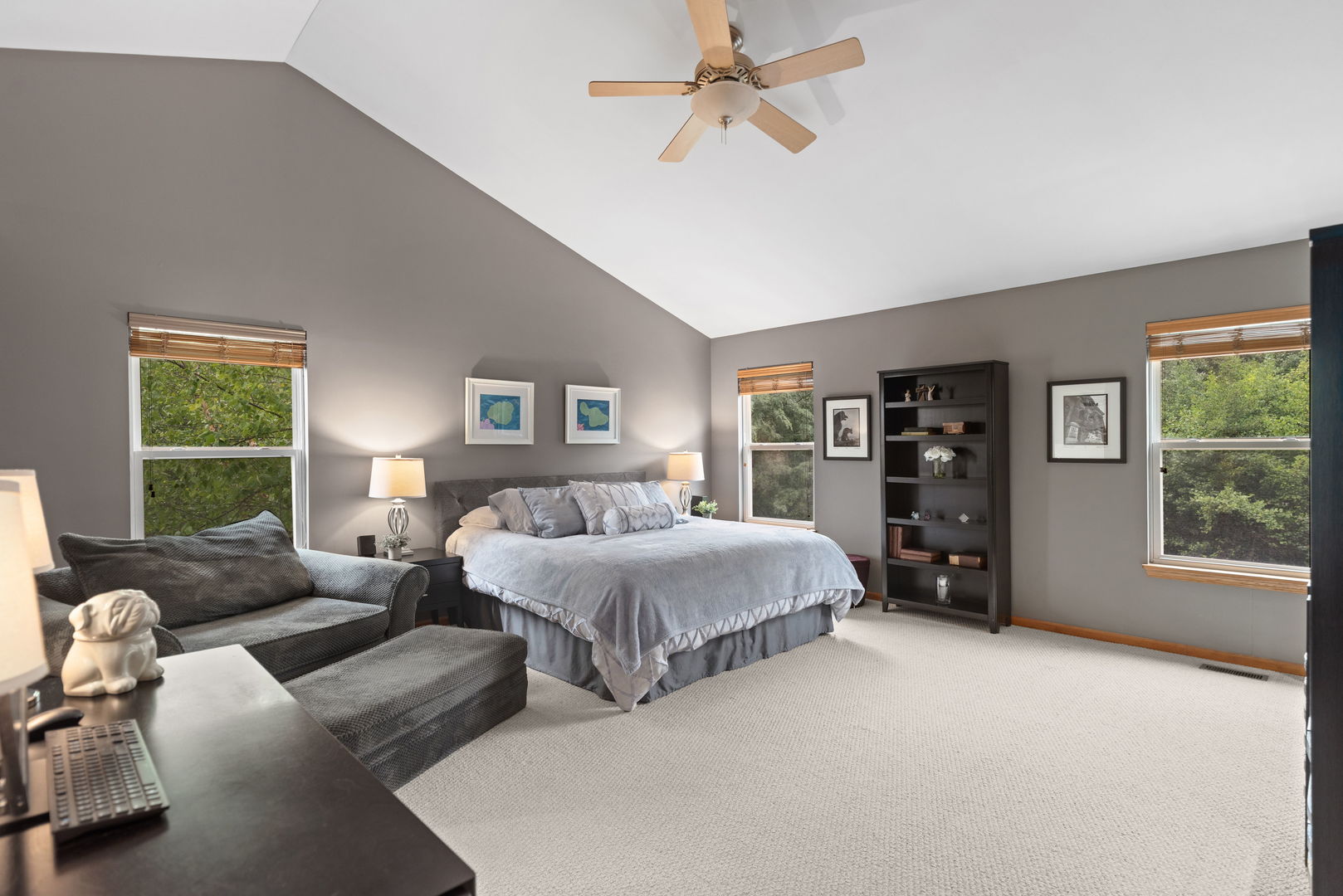 1476 Wildmeadow Road Round Lake, IL 60073 - Photo 14 of 37 a spacious bedroom with a bed a couch and a window