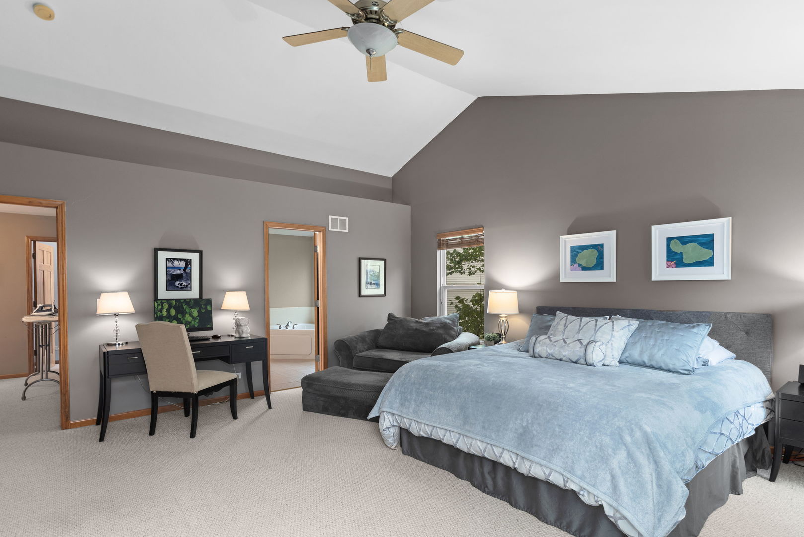 1476 Wildmeadow Road Round Lake, IL 60073 - Photo 15 of 37 a bedroom with a bed and a chandelier