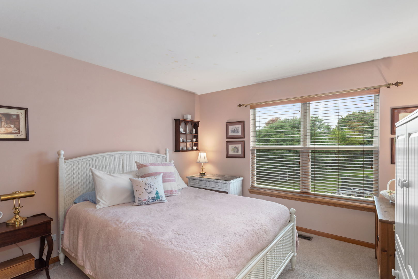 1476 Wildmeadow Road Round Lake, IL 60073 - Photo 17 of 37 a bedroom with a large bed and a large window