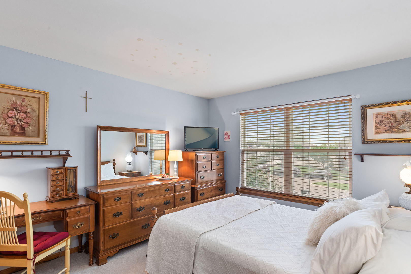 1476 Wildmeadow Road Round Lake, IL 60073 - Photo 18 of 37 a bedroom with a bed and a dresser next to a window