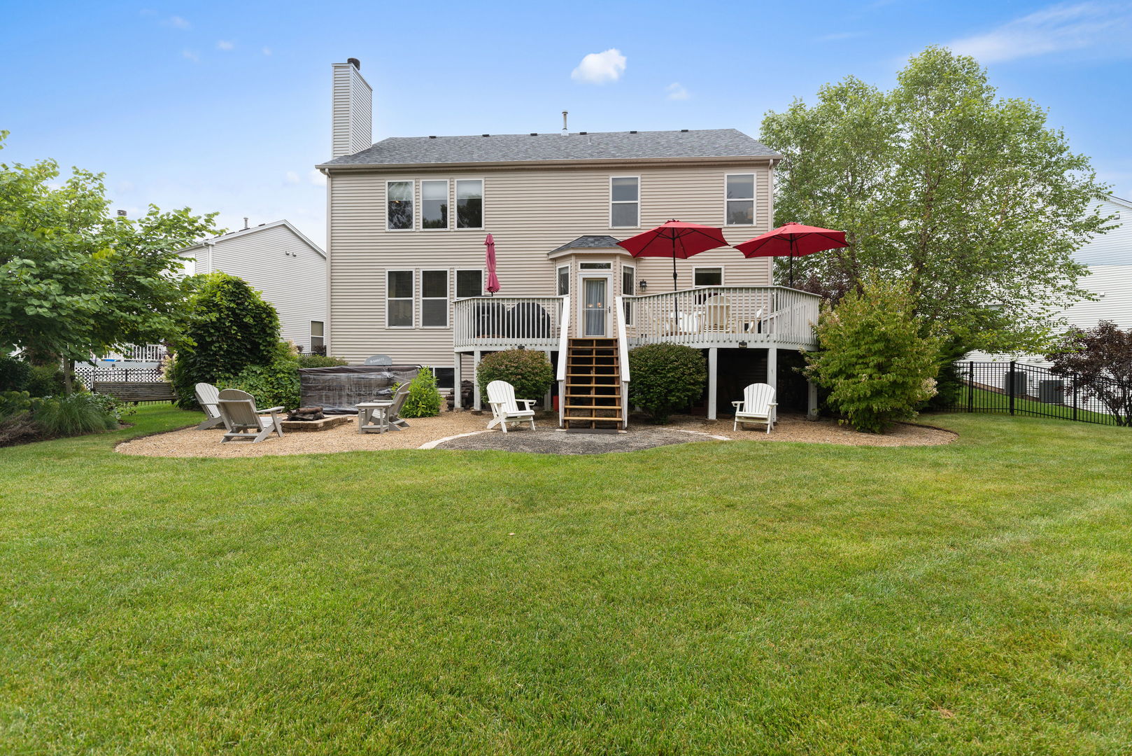 1476 Wildmeadow Road Round Lake, IL 60073 - Photo 22 of 37 a front view of a house with a yard and trees