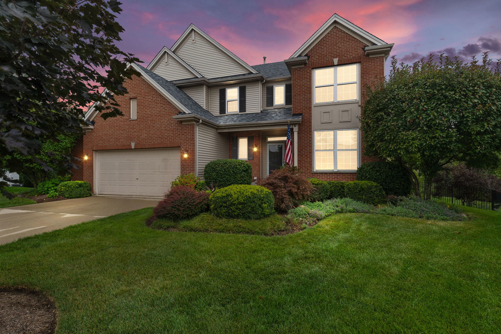 1476 Wildmeadow Road Round Lake, IL 60073 - Photo 27 of 37 a front view of a house with a yard and garage