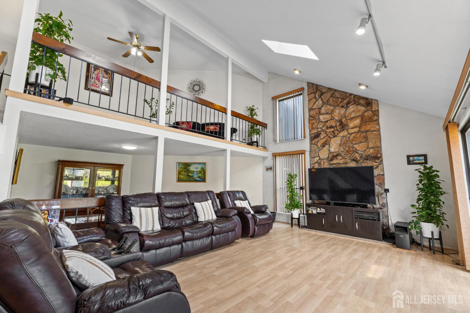 51 Westgate Drive Edison, NJ 08820 - Photo 12 of 48 a living room with furniture and a flat screen tv
