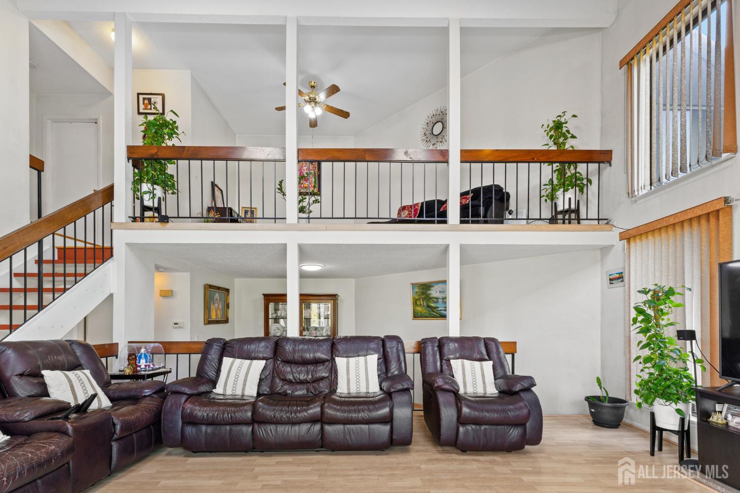 51 Westgate Drive Edison, NJ 08820 - Photo 13 of 48 a living room with furniture and a potted plant