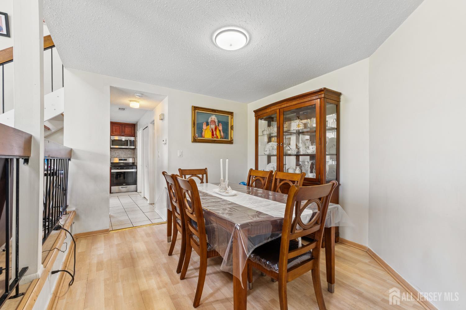 51 Westgate Drive Edison, NJ 08820 - Photo 14 of 48 a view of a dining room with furniture and a window